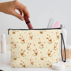 Beige Easter bunny makeup bag with zipper and hand placing lipstick inside