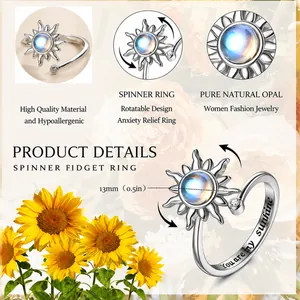 Detail of silver sunflower spinner ring with 13mm opal for anxiety relief and adjustable band