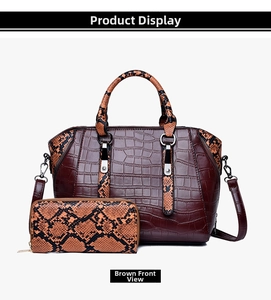 Front view of brown vintage tote bag set with crocodile and snake patterns