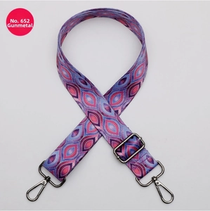 Adjustable woven purse strap with colorful geometric patterns and gunmetal hardware