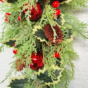 Nordic Christmas teardrop swag with green pine needles, red berries and natural pine cones