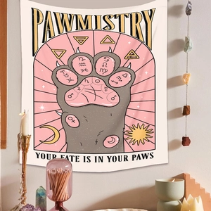 Detail of pink cat pawmistry tapestry with mystical candles and bohemian decor