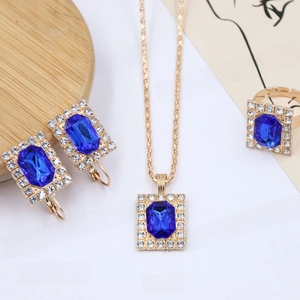 Detail view of a blue rectangular crystal jewelry set with sparkling rhinestones