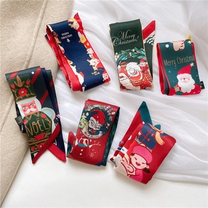 Christmas themed skinny silk scarves with nutcracker and reindeer patterns in festive colors