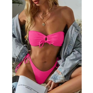 Detail of rose pink ribbed bikini set with bandeau top and side tie high cut bottoms