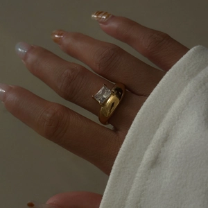Retro 18k gold plated chunky ring with a large rectangular white zircon on model