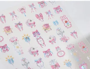 Detailed view of magic girl themed nail stickers with 3D rhinestones and pastel gradients