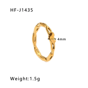 Detail shot of 4mm gold titanium steel ring with wave texture and mirror finish