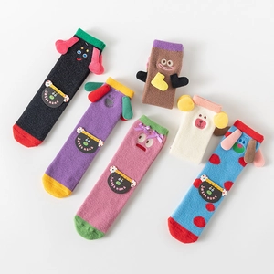 Five pairs of coral fleece thermal socks with cute 3D cartoon animal monster designs