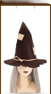 Detail of dark brown scarecrow witch hat with patch patterns and burlap rope decor