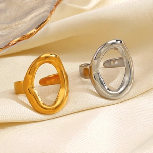 Minimalist irregular oval open rings in polished gold and silver finishes on satin