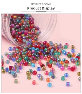 Macro view of 4mm iridescent glass seed beads pouring from a clear glass bottle