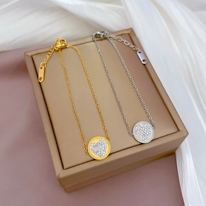 Titanium steel heart chain bracelet set in gold and silver finish with sparkling zircons