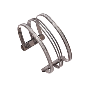 Industrial layered gunmetal open cuff bracelet with silver glitter and twisted textures