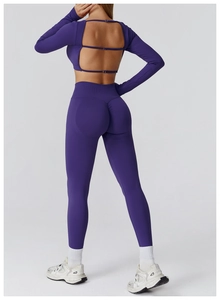 Detail of purple high-waisted yoga pants with scrunched butt and seamless fabric texture