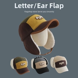 Detail of children's earflap cap with warm faux lamb wool lining and PUPI patch