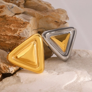 Minimalist chubby triangle geometric brooches in polished gold and silver metal finishes