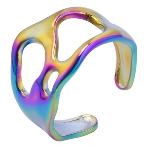 Detailed macro view of an irregular hollow stainless steel ring with rainbow plating