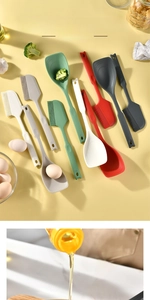 Macro detail of heat resistant silicone spatula and oil brush for daily kitchen use
