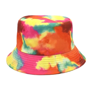 Detail of colorful tie-dye bucket hat showing stitching on the brim and cotton fabric
