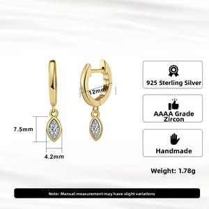 Detail of 925 sterling silver gold earrings showing S925 hallmark and marquise zircon