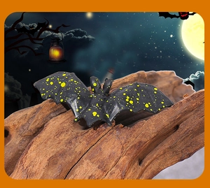 Detailed view of a black and yellow bat figurine for Halloween house decorations