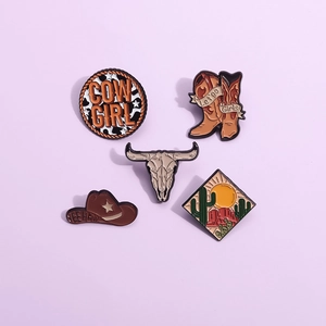 5-piece western cowboy enamel pin set with boots, hat, and bull motifs on purple background