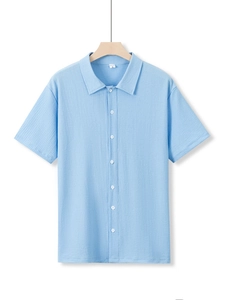Close-up detail of light blue short sleeve men's shirt with waffle knit texture
