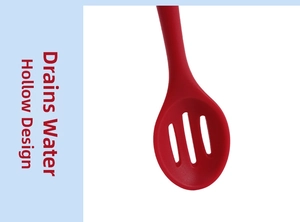 Macro view of red silicone slotted spoon featuring a hollowed-out design for water filtering