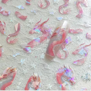 Close-up of holographic 5D pink dragon nail decals with iridescent laser effects