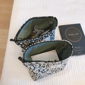 Floral textured makeup bag set with black and white jacquard pattern and top zipper