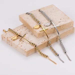 Minimalist beaded cross bracelet with oval medal pendant in gold and silver finish