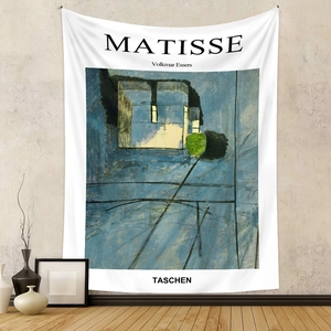 Detail of Matisse blue abstract art tapestry hanging on a minimalist beige wall décor