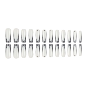 French tip press-on nails with black glitter gradient and silver rhinestones in long coffin shape