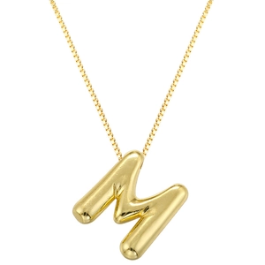 Macro detail of golden 3D bubble letter M pendant on a delicate box chain necklace