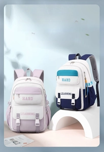 Detail of trendy purple and blue school backpacks with multi-layer storage and buckles