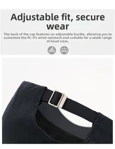 Detail view of the adjustable silver metal buckle and black strap on a baseball cap