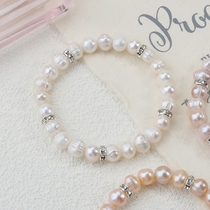 Natural freshwater pearl stretch bracelet with silver rhinestone spacers in white and pink