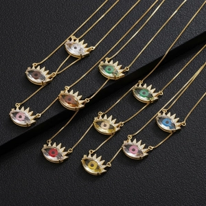 Macro view of multi-color evil eye necklaces with cubic zirconia and gold plating