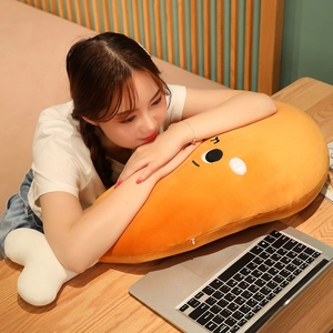 A cozy scene of a young girl resting on a large cartoon chicken leg plush toy on a desk