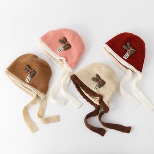Knitted baby earflap beanie with rabbit ears and warm cotton lining in four color variants