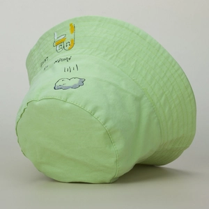Detail of light green bucket hat with hand-drawn graffiti and Power of Love slogan