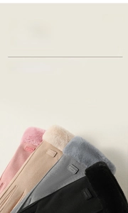 Detail view of warm winter gloves in pink, beige, grey and black with soft faux fur cuffs