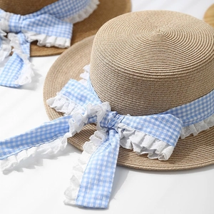 Straw boater hat with gingham ribbon and lace bow detail for summer sun protection