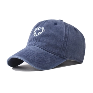 Detail of washed navy cotton baseball cap with white vintage letter embroidery