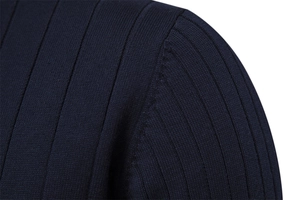 Macro detail of navy blue ribbed knit sweater showing high-quality shoulder seam stitching