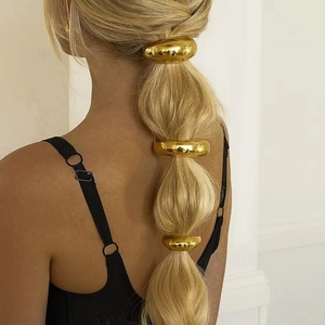 Set of three golden polished stainless steel hair rings for ponytail styling