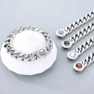 Detail of 13mm Cuban link necklace with skull clasp and gemstone jewelry accessories