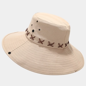 Close-up of khaki wide brim outdoor sun hat featuring durable canvas and woven rope detail