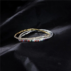 Detailed close-up of 2.0mm thin crystal tennis bracelets on a premium black silk fabric